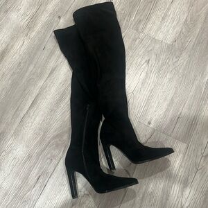 Black knee high suede boots.